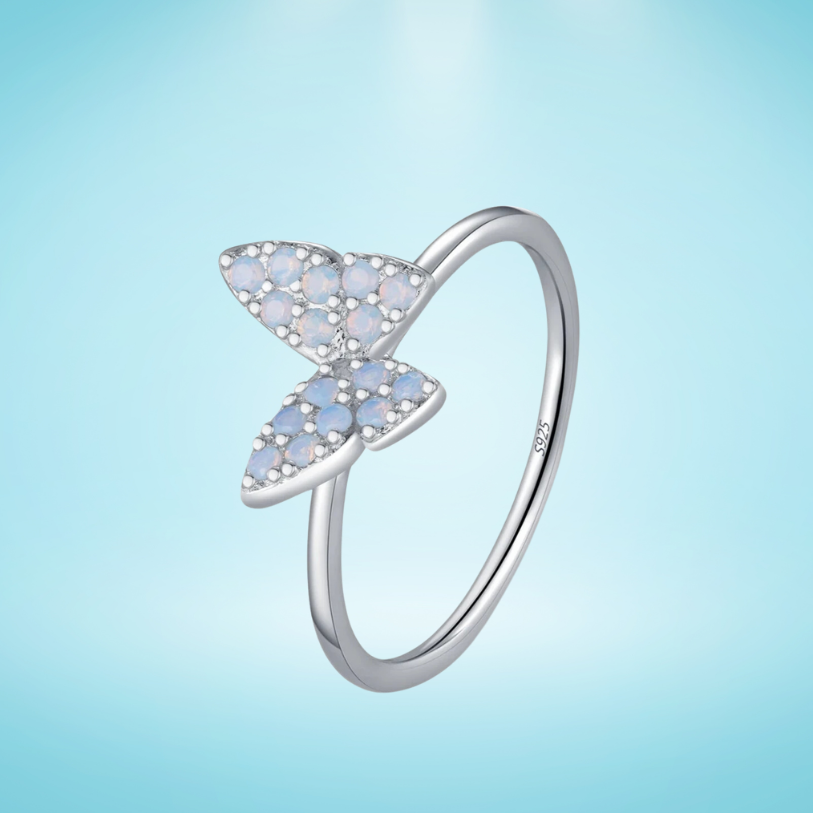 Sterling silver ring with a delicate butterfly shape inlaid with shimmering opal stones