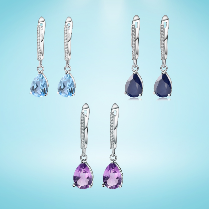 Set of three sterling silver drop earrings with pear-shaped stones in blue, navy, and violet, accented with pavé-set crystals