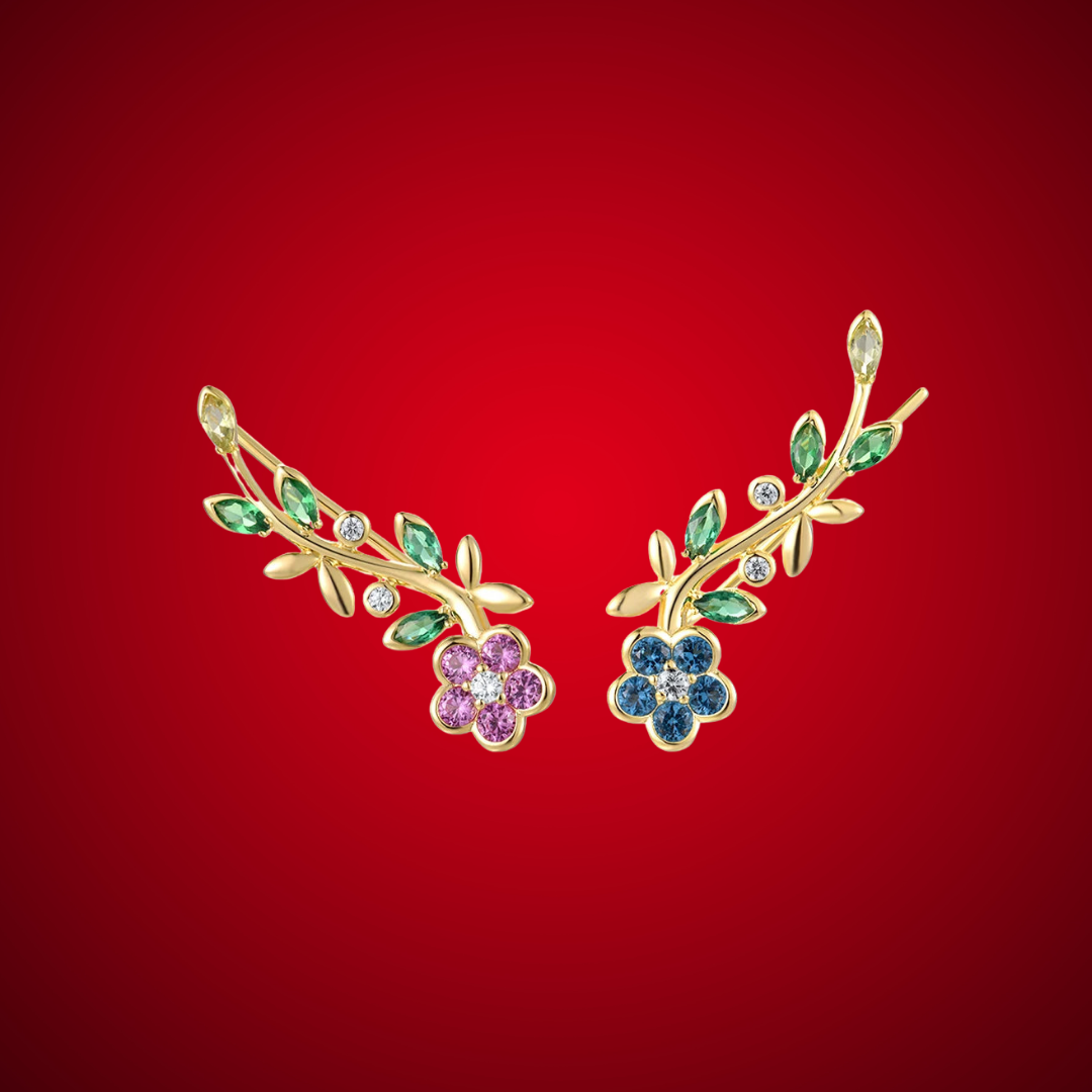 Gold floral earrings featuring multicoloured gemstones in a vine-inspired arrangement.