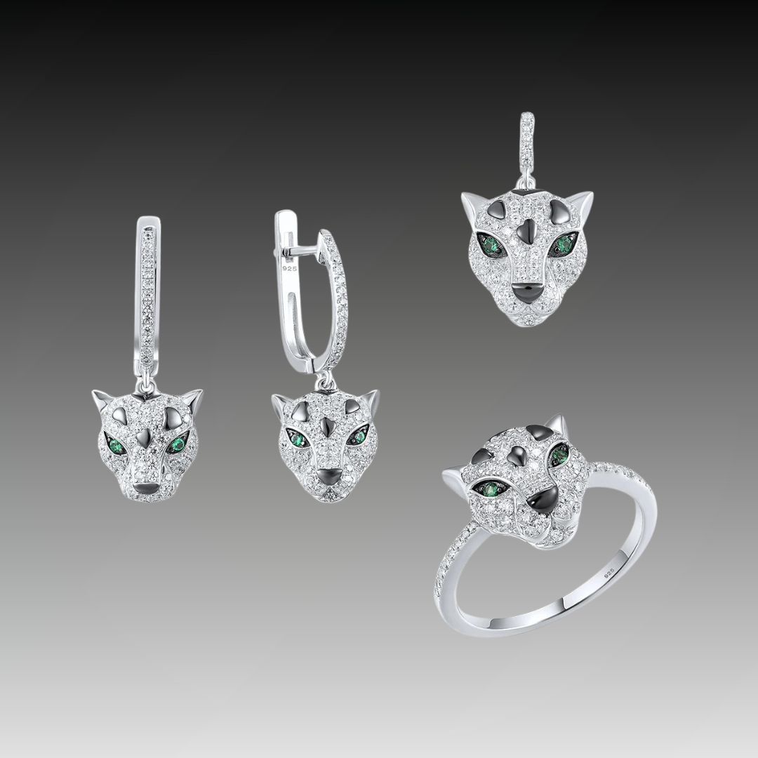 Jewelry set featuring panther head designs with pavé detailing and green gemstone eyes