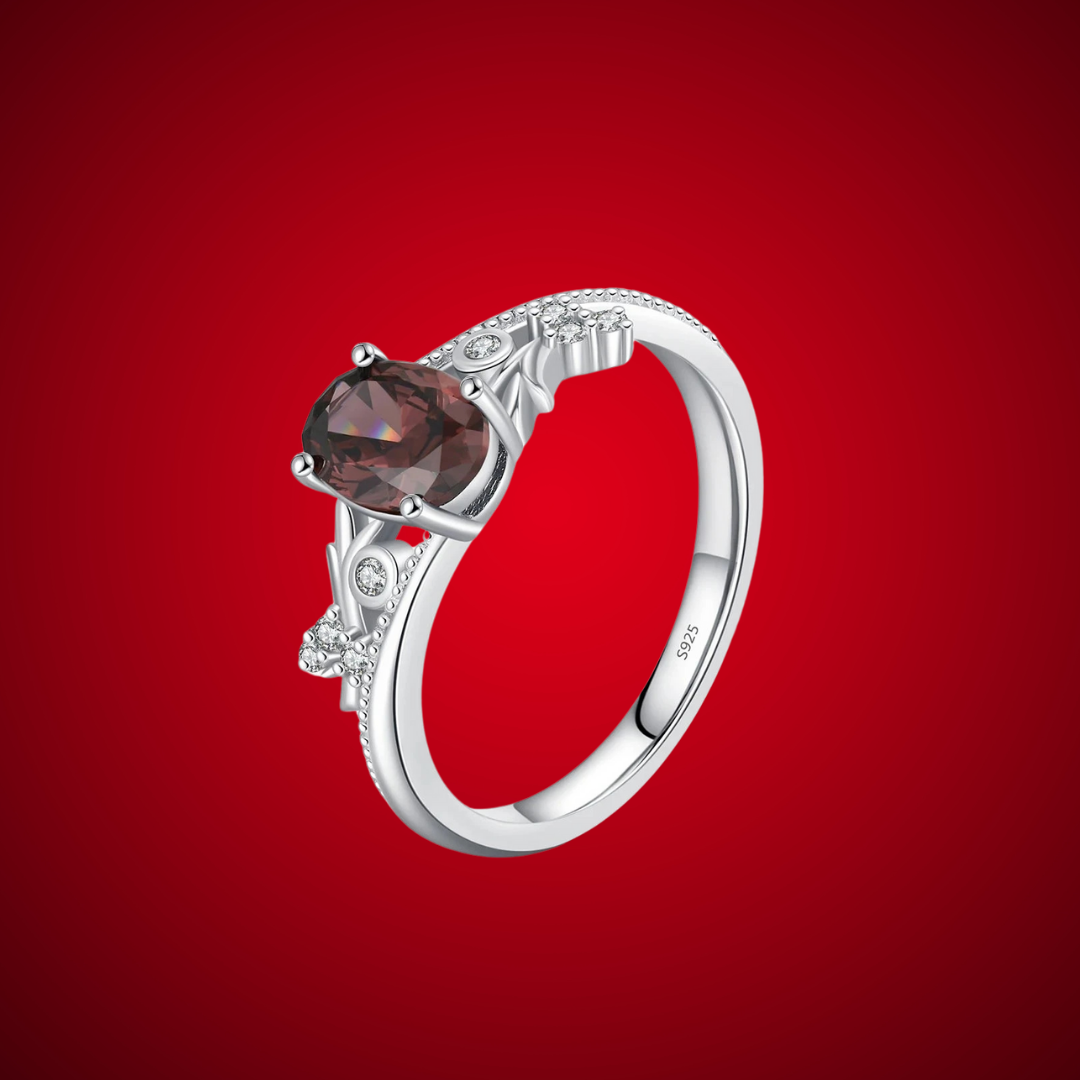 Sterling silver ring with a deep hazelnut-brown oval stone and decorative band