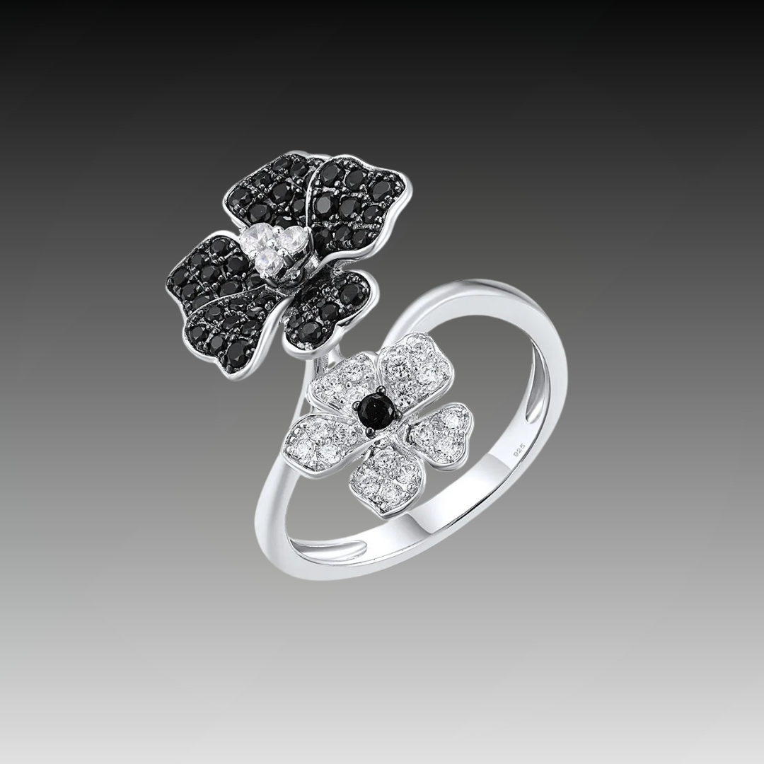 Sterling silver open ring with black and white crystal-studded flowers, part of the Rosa Nera collection.