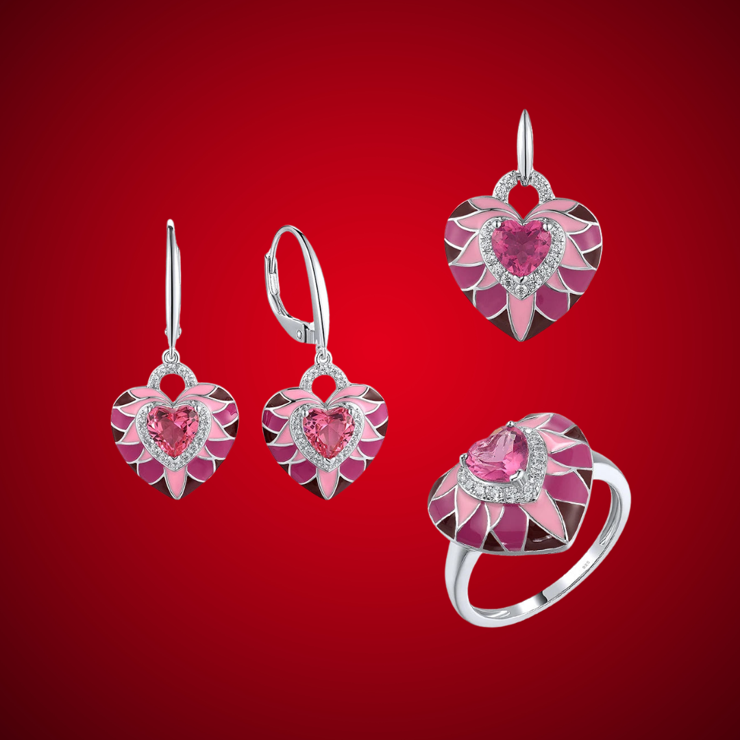 Parete del Cuore jewelry set featuring heart-shaped pink enamel and crystal designs in silver-tone settings, including earrings, pendant, and ring.