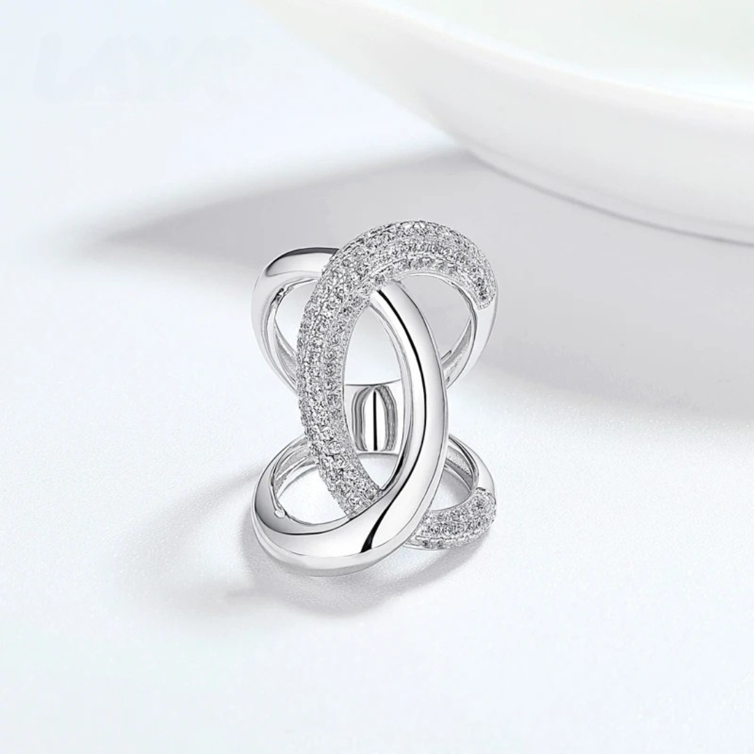 Silver ring with bold interlocking loops and pavé detailing
