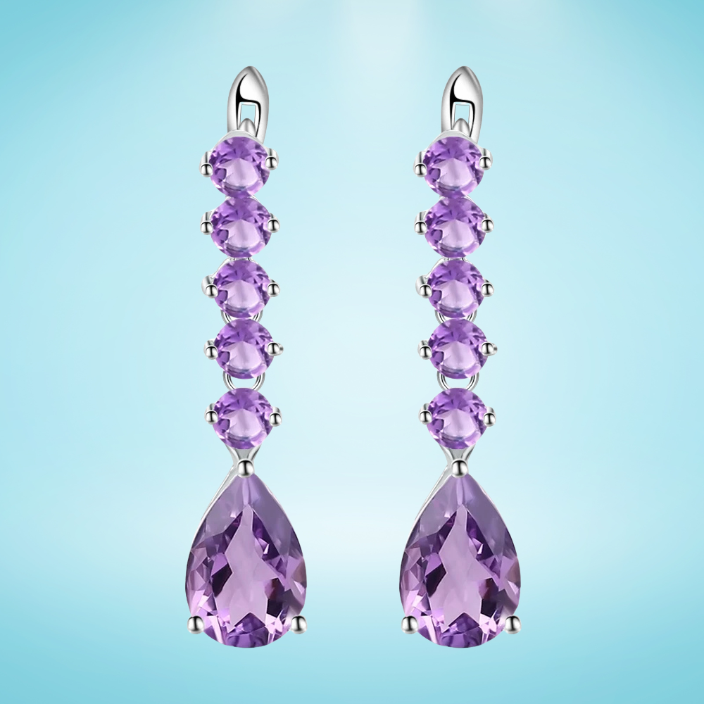 Sterling silver drop earrings with a vertical line of round amethyst stones and teardrop-shaped violet gemstones