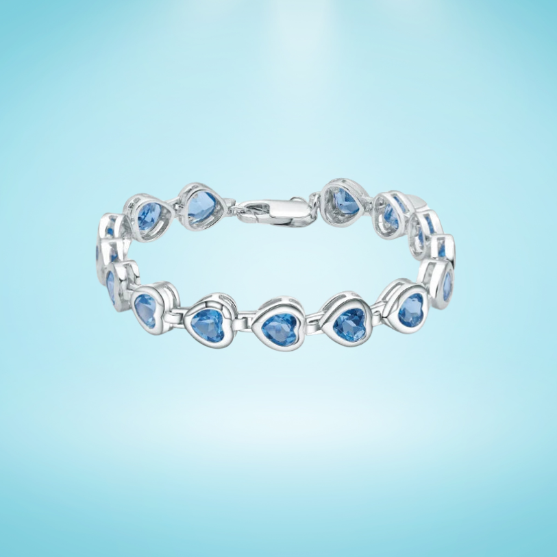 Silver bracelet with heart-shaped blue stones in a linked design