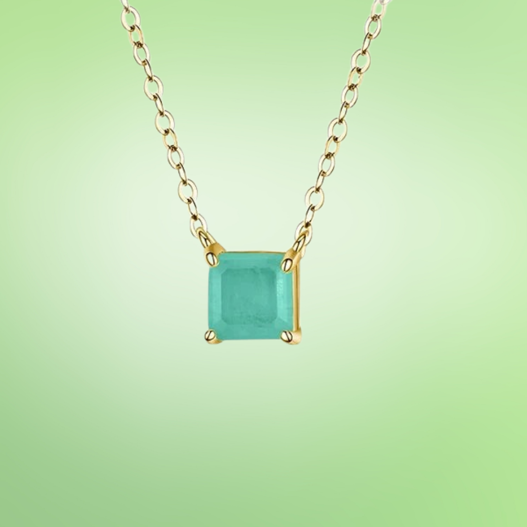 Square light green gemstone pendant on a fine gold chain.