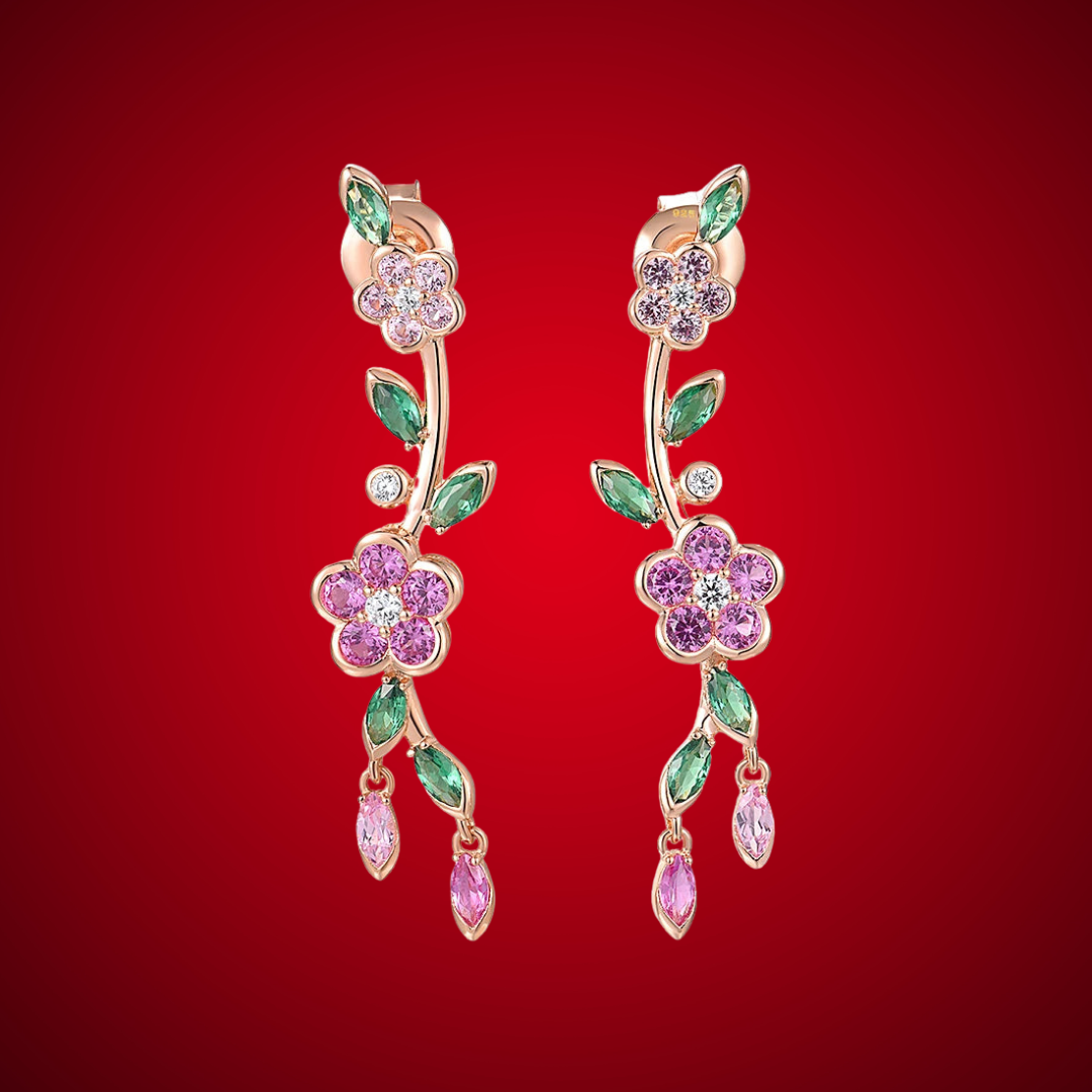 Fiore di Vite earrings with pink flower-shaped stones, green marquise-cut leaves, and delicate drop accents.