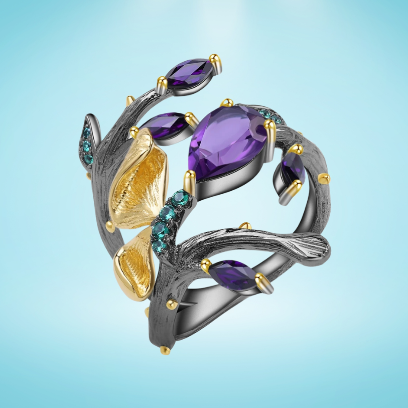 Black branch-style ring with purple stones, gold accents, and turquoise details