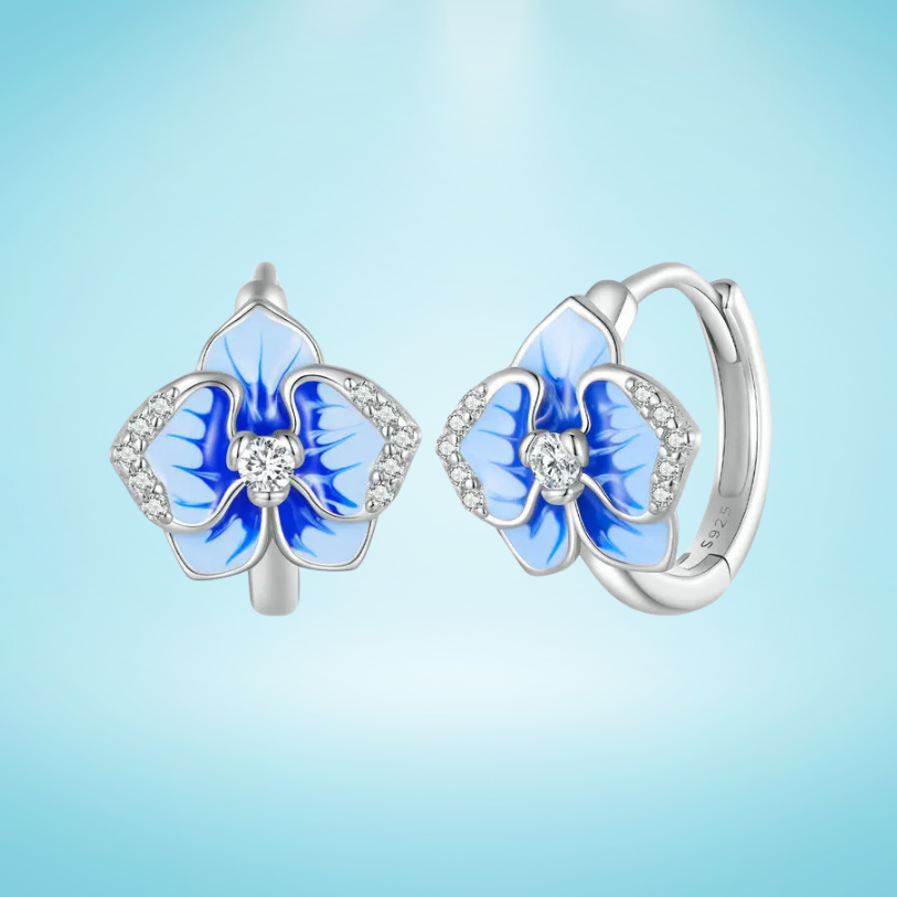 Sterling silver hoop earrings with blue enamel orchid flowers and crystal accents