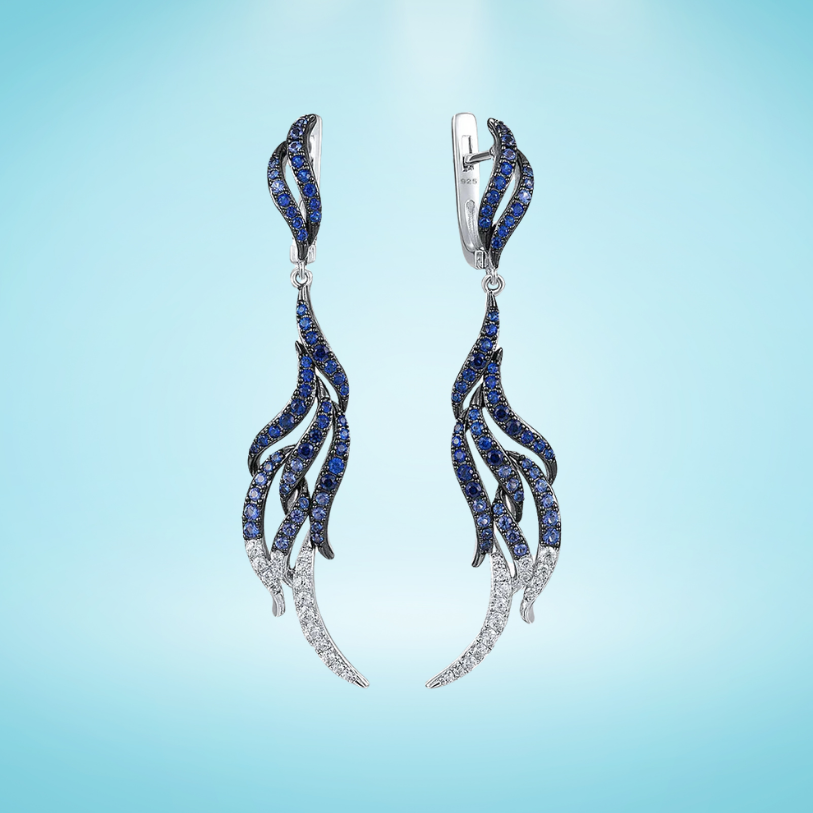 Sterling silver drop earrings with blue and white crystal feather design