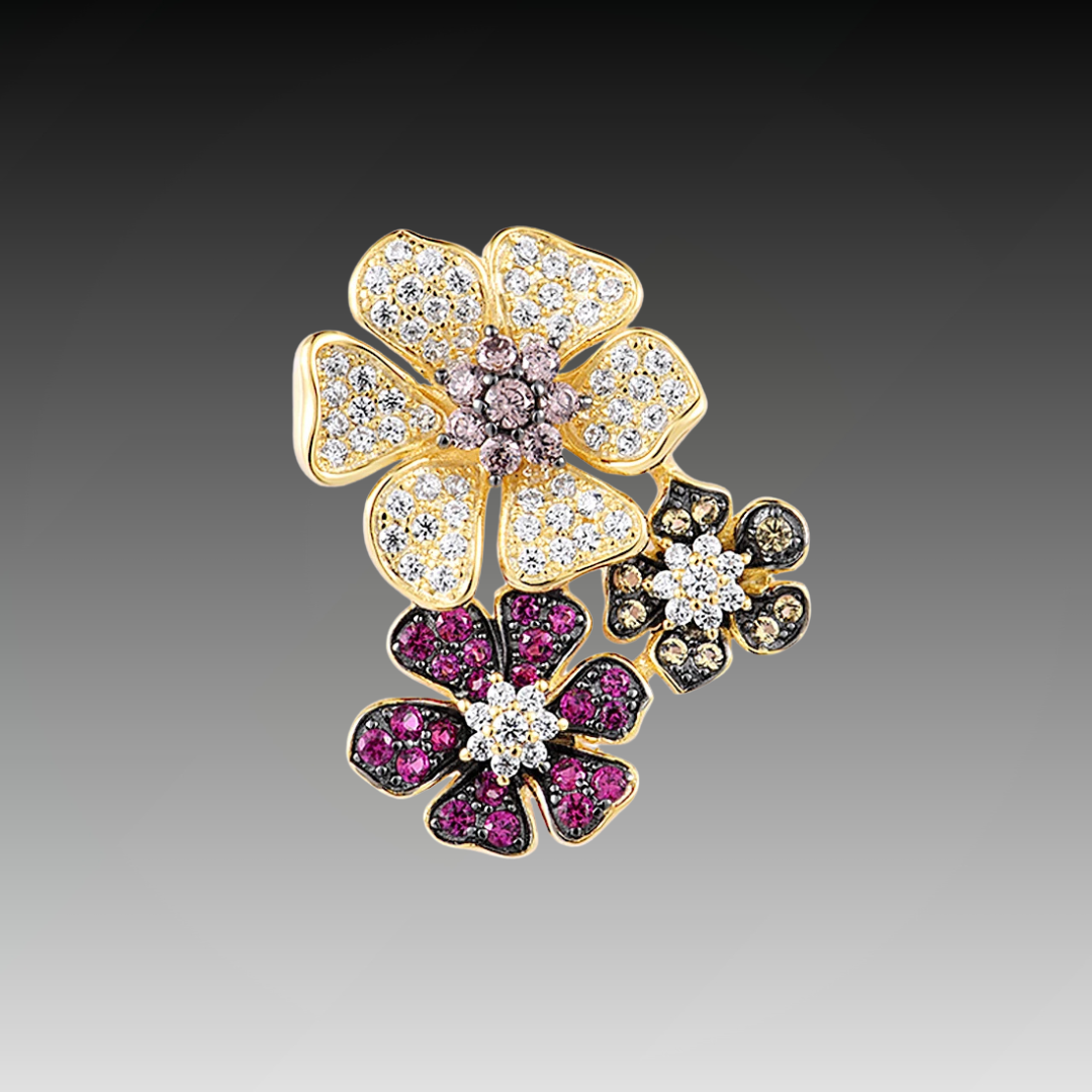 Clustered flower-shaped pendant with white, pink, red, and black pavé stones in gold-toned settings