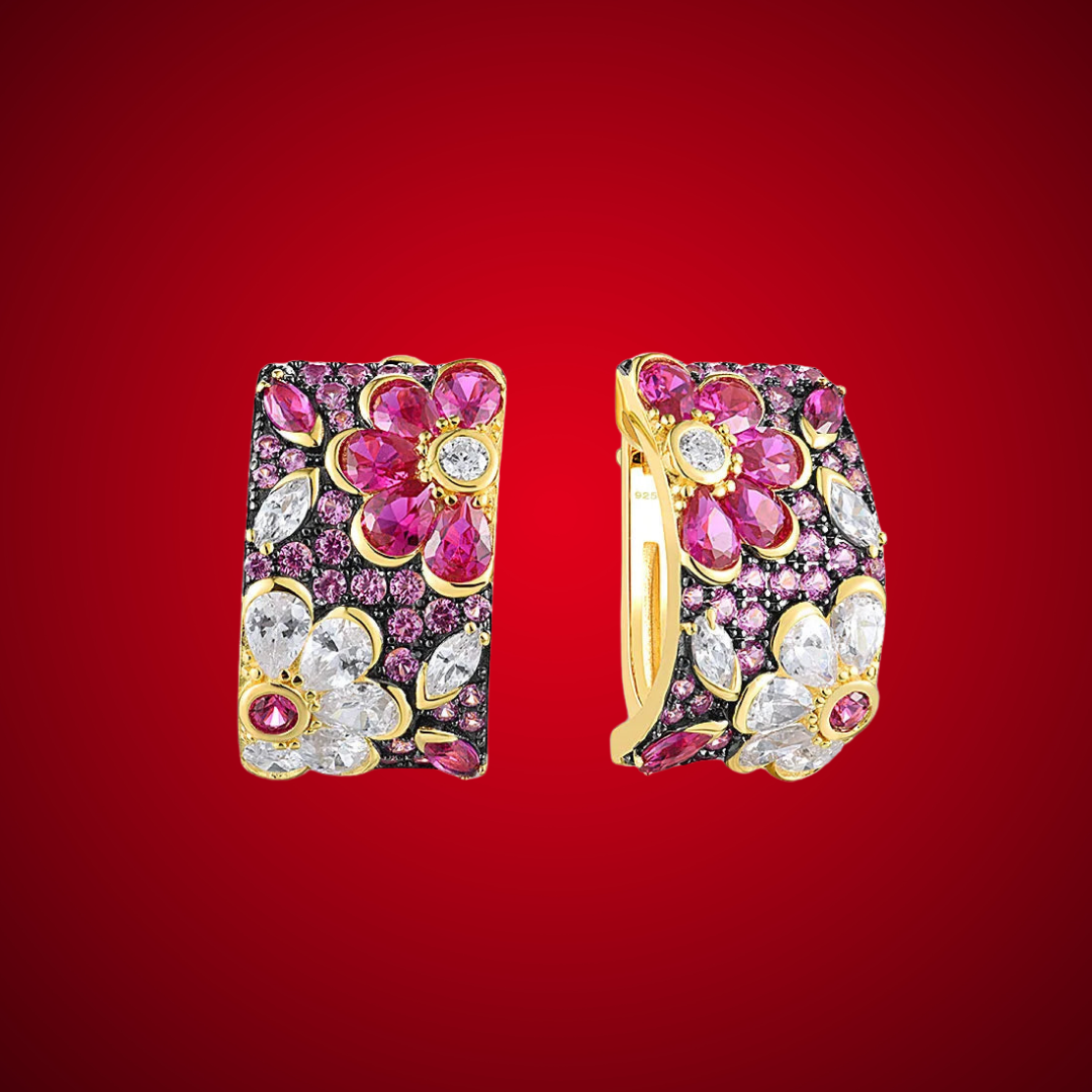 Gold huggie earrings adorned with floral clusters of pink and white stones in marquise and round cuts.