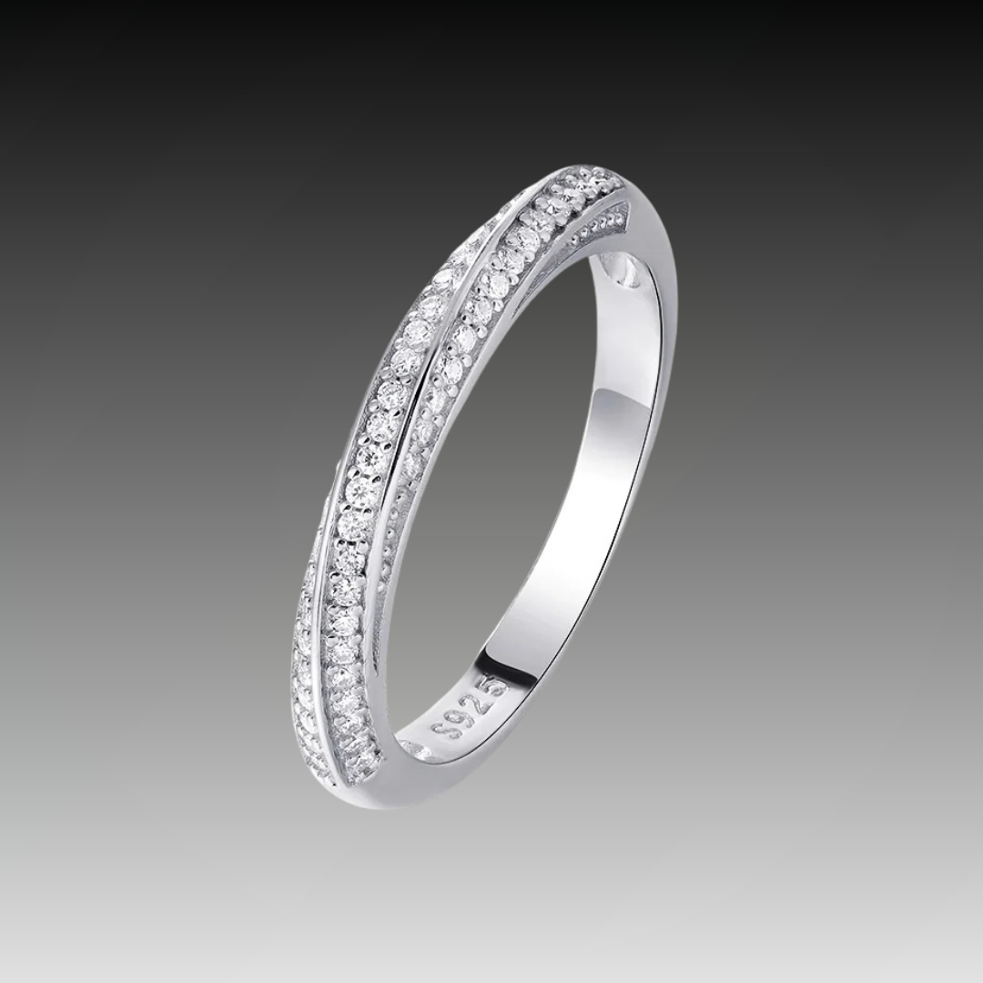 Slim silver ring featuring two parallel rows of small white stones, forming a subtle twist in the center, from the Bianco Nero collection.