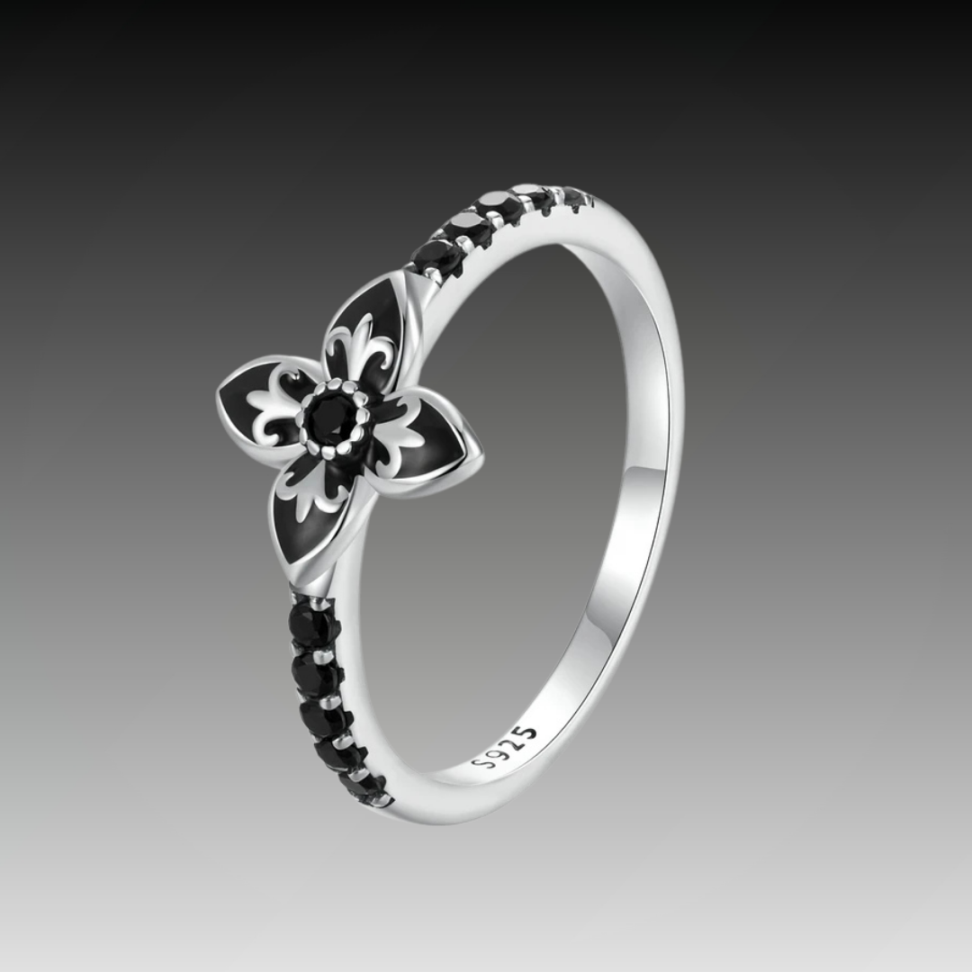 Sterling silver ring featuring a black enamel floral design with black stones set along the band, from the Gotica line.