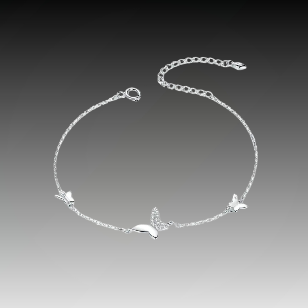 Delicate silver bracelet featuring three butterfly charms, one with sparkling pavé stones, from the Bianco Nero collection.