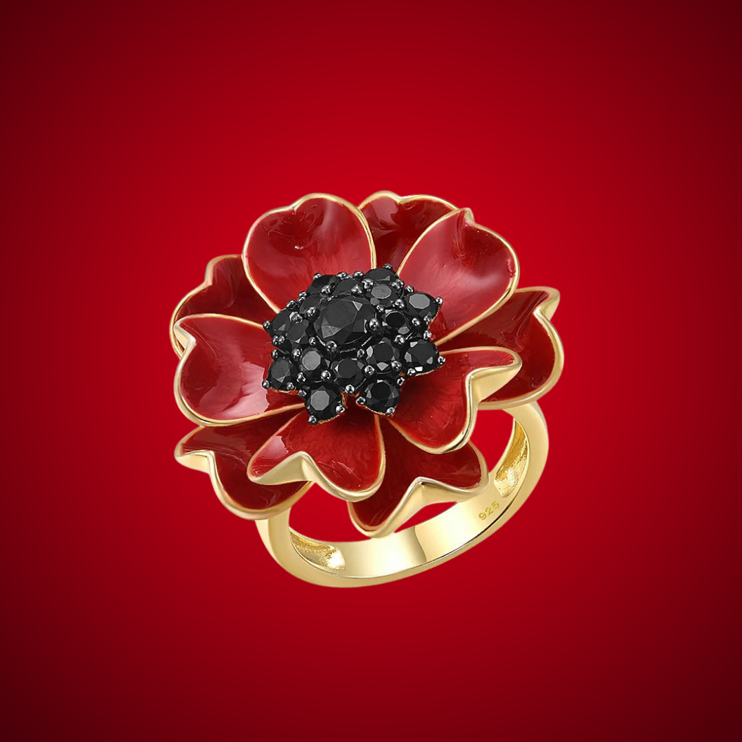 Papavero ring with layered red enamel petals and black crystal centerpiece on a gold band.