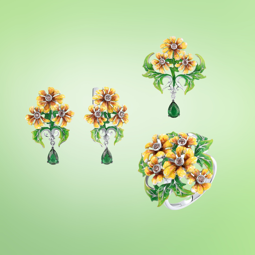 Jewelry set featuring yellow-orange flowers with green enamel leaves and teardrop green gemstone dangles