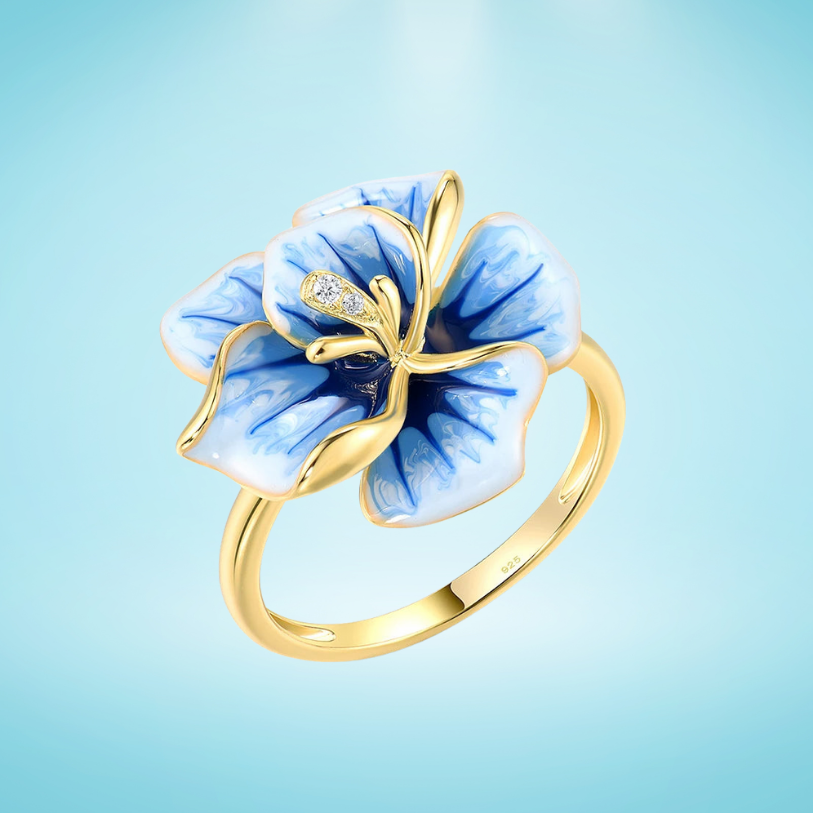 Gold-plated ring with hand-painted blue and white enamel flower and crystal accents
