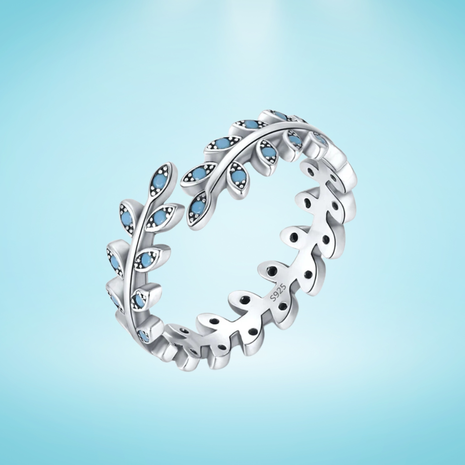Silver ring shaped like a delicate laurel branch with light turquoise enamel accents on the leaves
