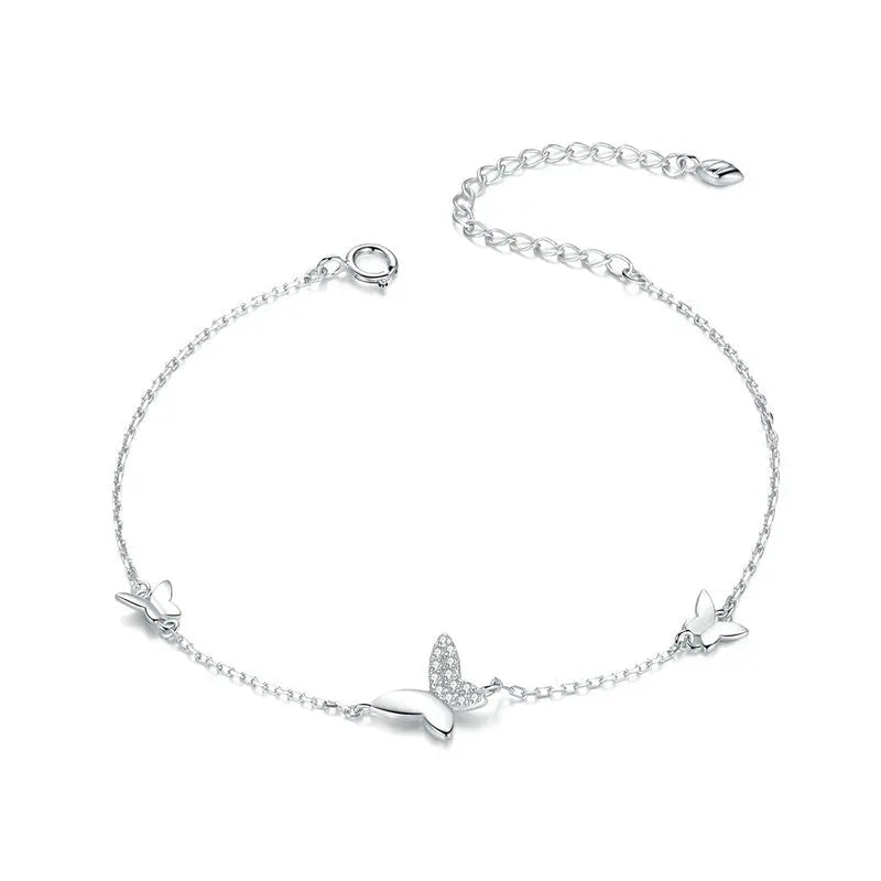 Delicate silver bracelet featuring three butterfly charms, one with sparkling pavé stones, from the Bianco Nero collection.