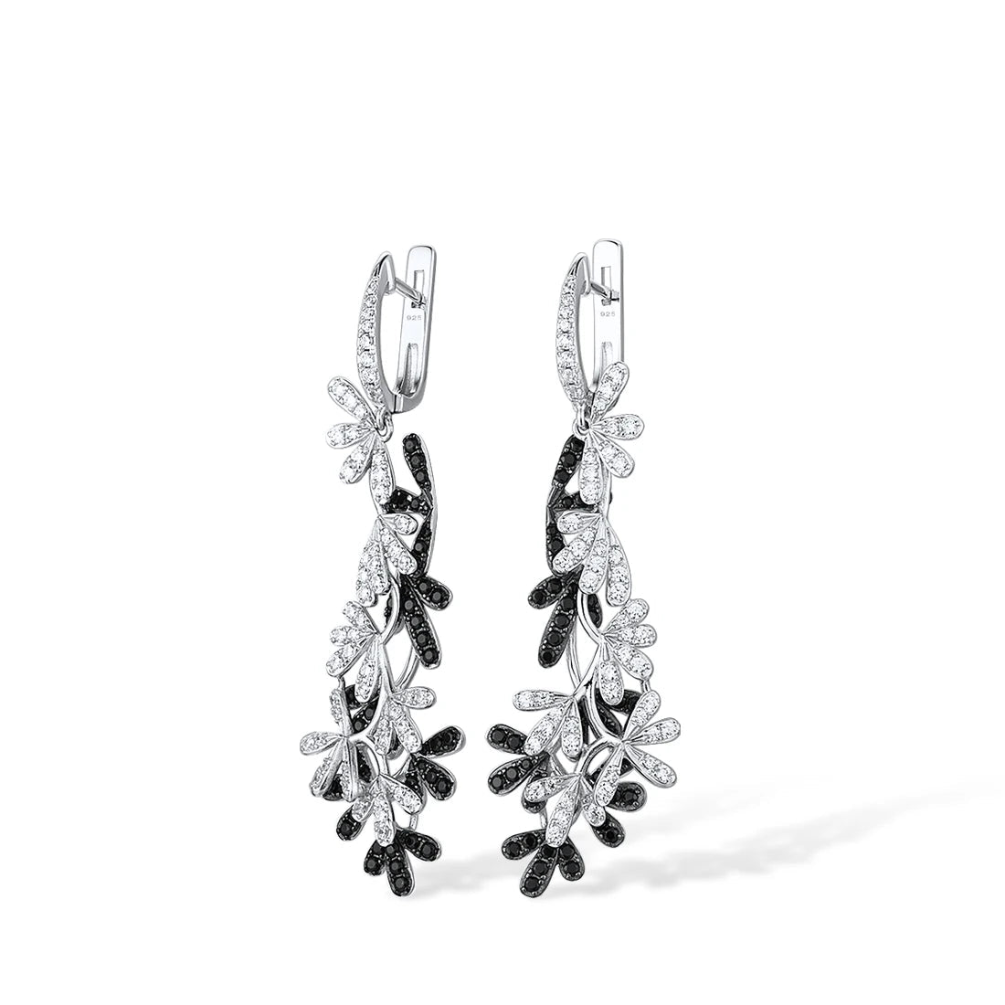 Long silver earrings with interwoven black and white gemstone-studded olive leaf designs.