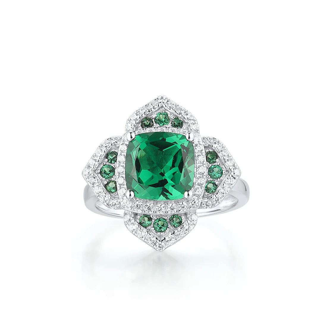 Silver ring with a large cushion-cut green center stone, surrounded by pavé-set crystals in a layered floral-inspired setting