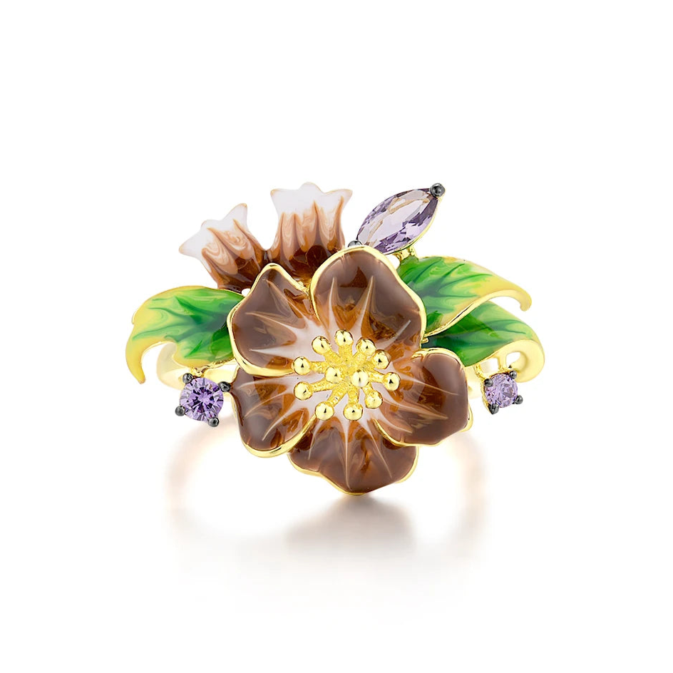 Gold ring with deep purple flower enamel, green leaves, and amethyst-like stones
