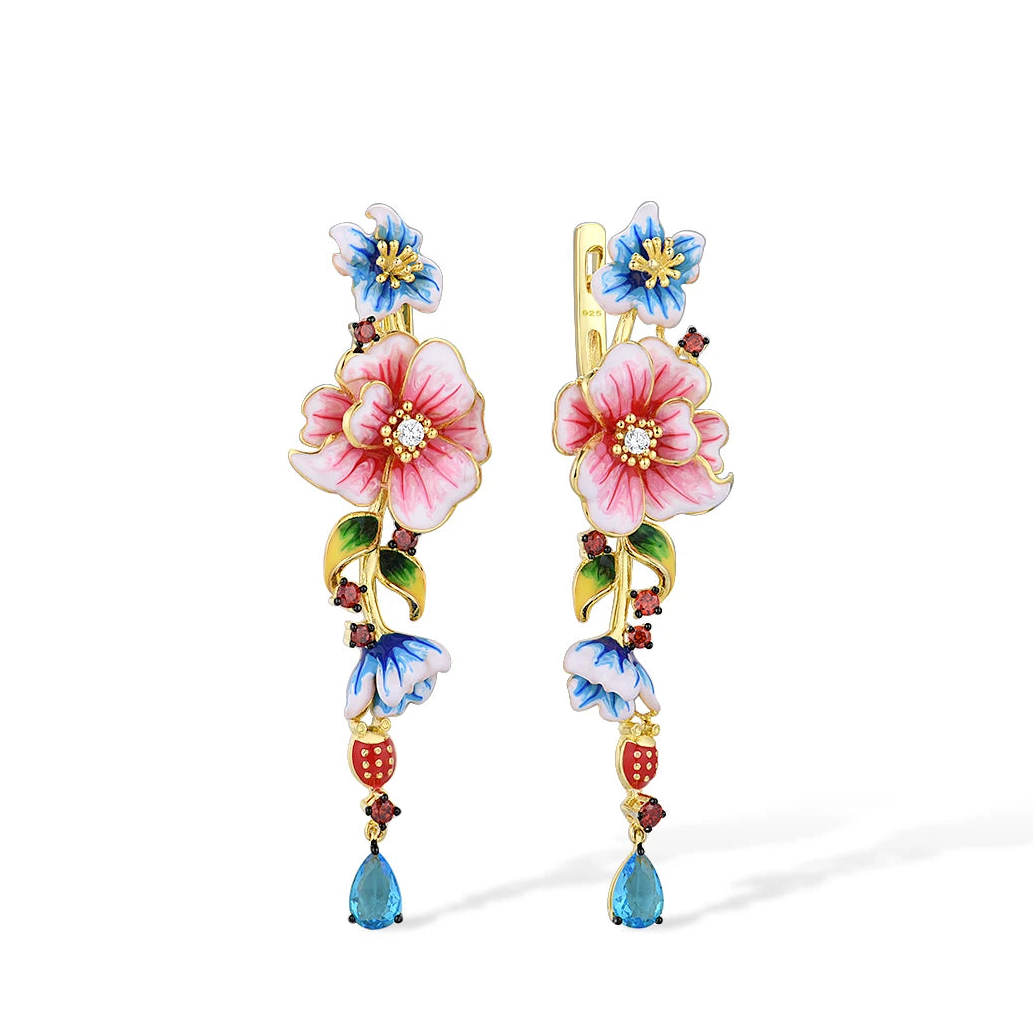 Gold-plated drop earrings with pink, blue, and red enamel flowers and teardrop blue gemstones