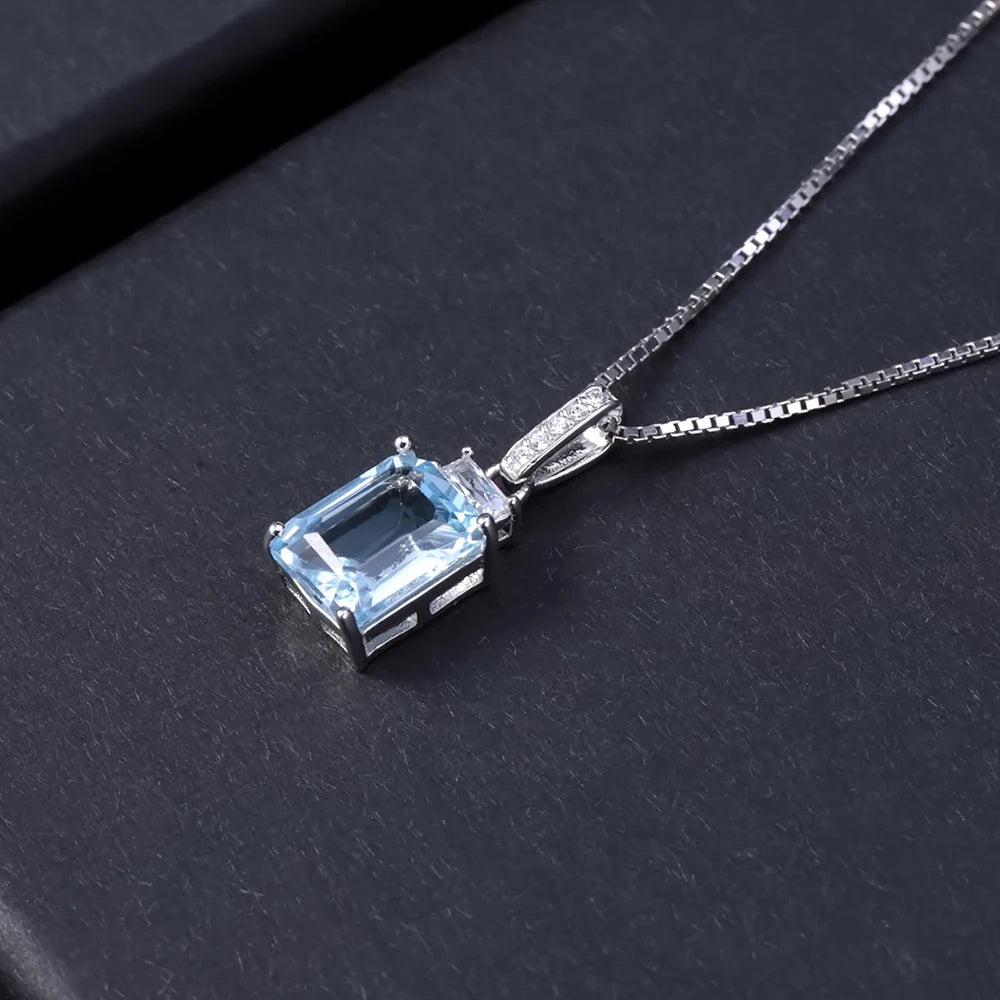 Sterling silver necklace with rectangular and baguette-cut light blue gemstones and a pavé-set bail