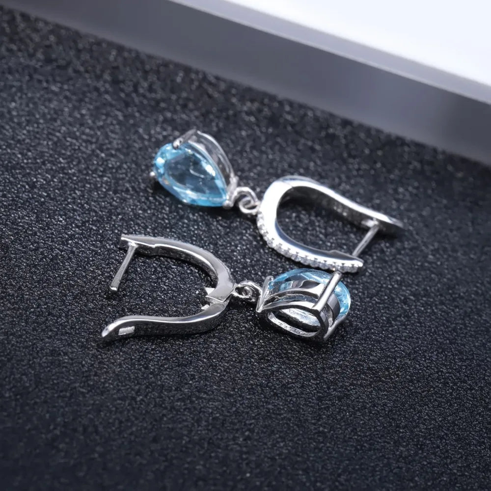 Set of three sterling silver drop earrings with pear-shaped stones in blue, navy, and violet, accented with pavé-set crystals