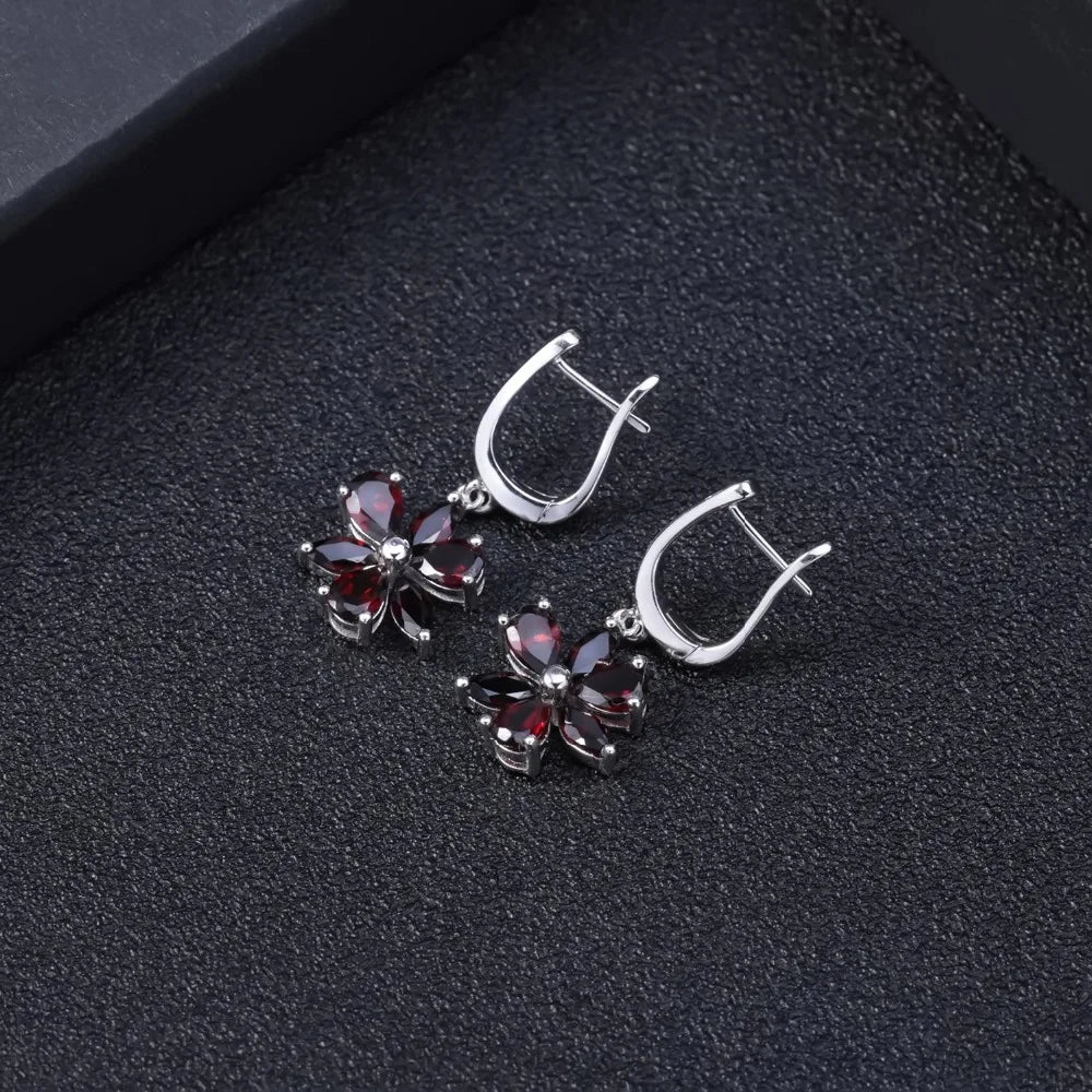 Silver floral drop earrings featuring five deep garnet-brown marquise stones arranged as petals, from the Rossa Collection.