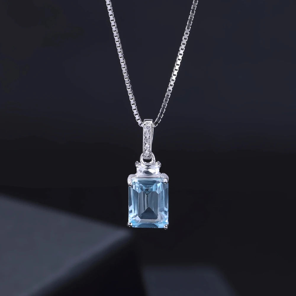 Sterling silver necklace with rectangular and baguette-cut light blue gemstones and a pavé-set bail