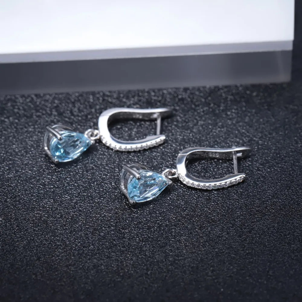 Set of three sterling silver drop earrings with pear-shaped stones in blue, navy, and violet, accented with pavé-set crystals