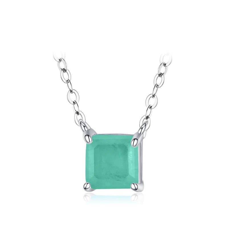 Square light green gemstone pendant on a fine gold chain.