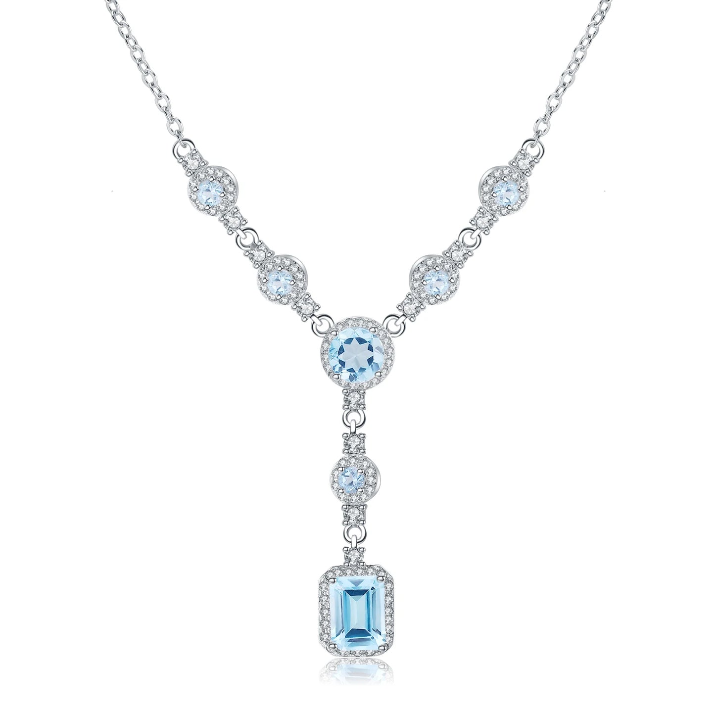 Silver necklace with round and emerald-cut light blue stones and halo settings