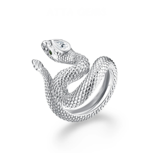 Textured silver snake ring coiled in a striking pose with green eyes and a marquise-cut clear stone set in the head.