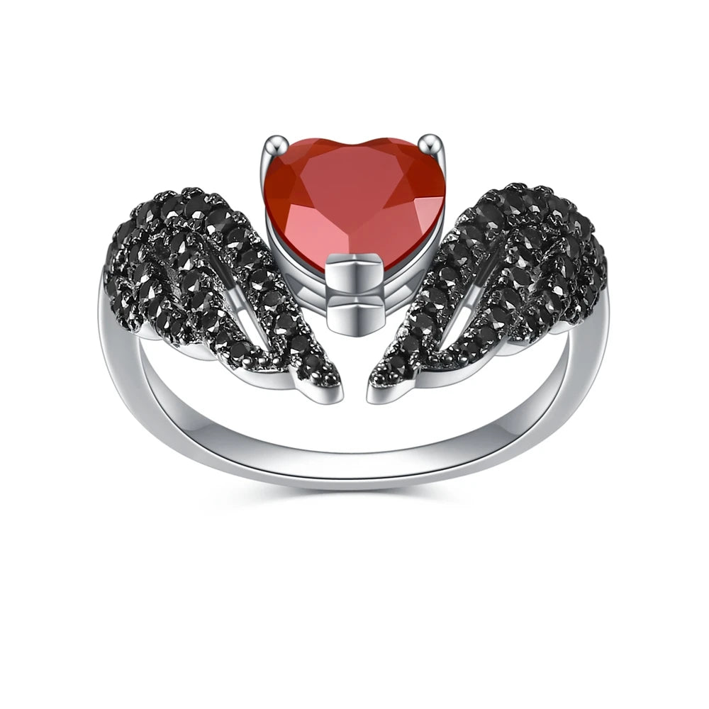 Sterling silver ring with a heart-shaped black gemstone flanked by pavé-set wing-like details, from the Ali Nere design.