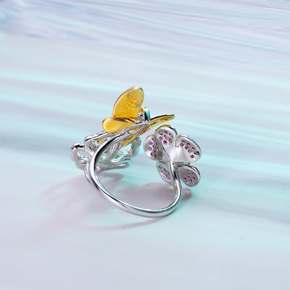 Open floral ring with red gemstone flowers and butterflies in silver and gold tones from the Rossa Collection.