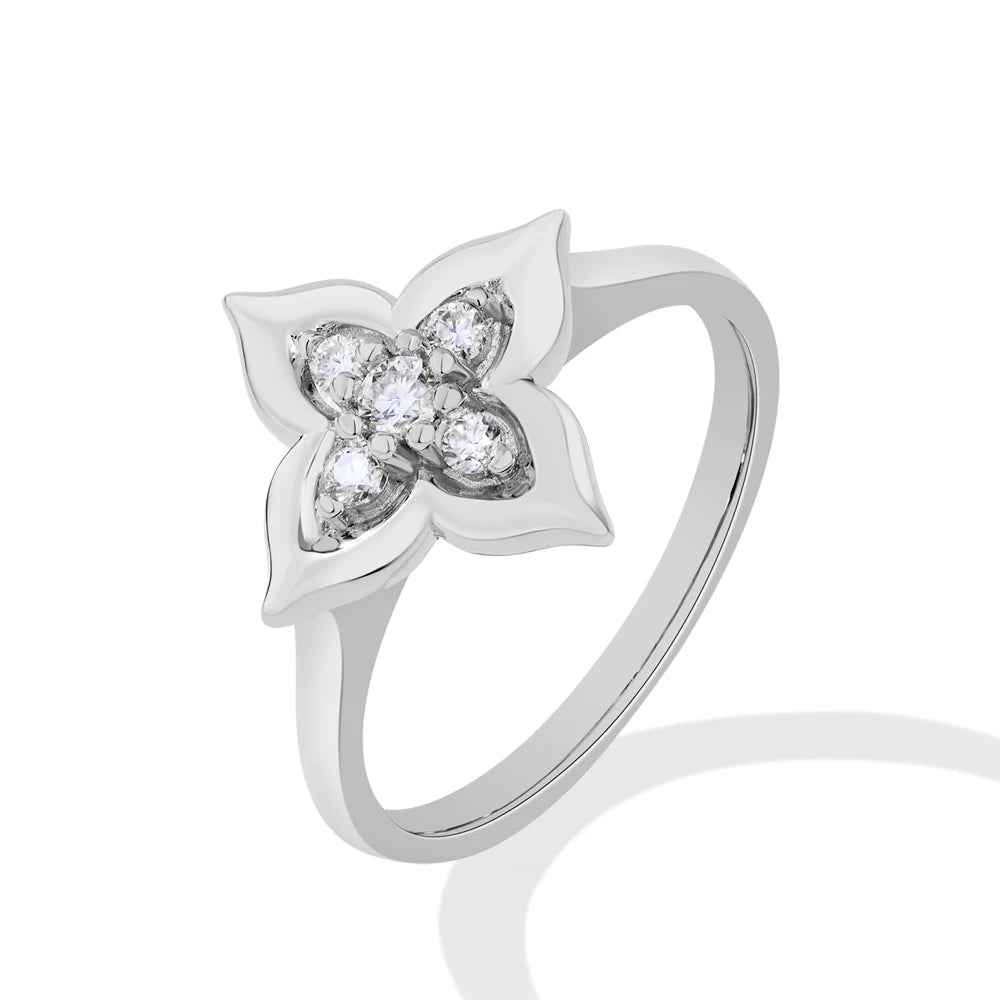 Moissanite floral ring in white gold and yellow gold plating, shown on hand and styled in various settings