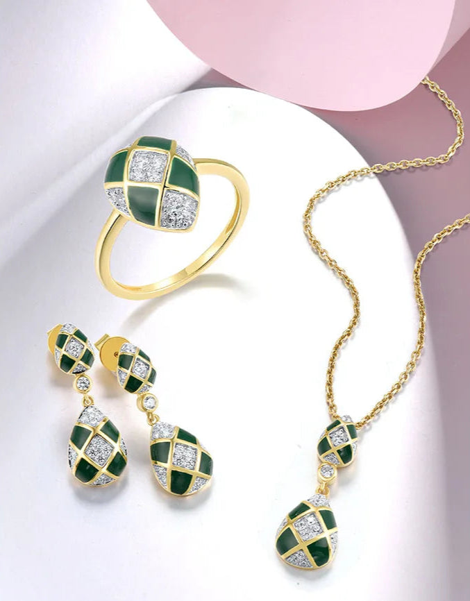 Gold and green checkered jewelry set with teardrop shapes and pavé white stones