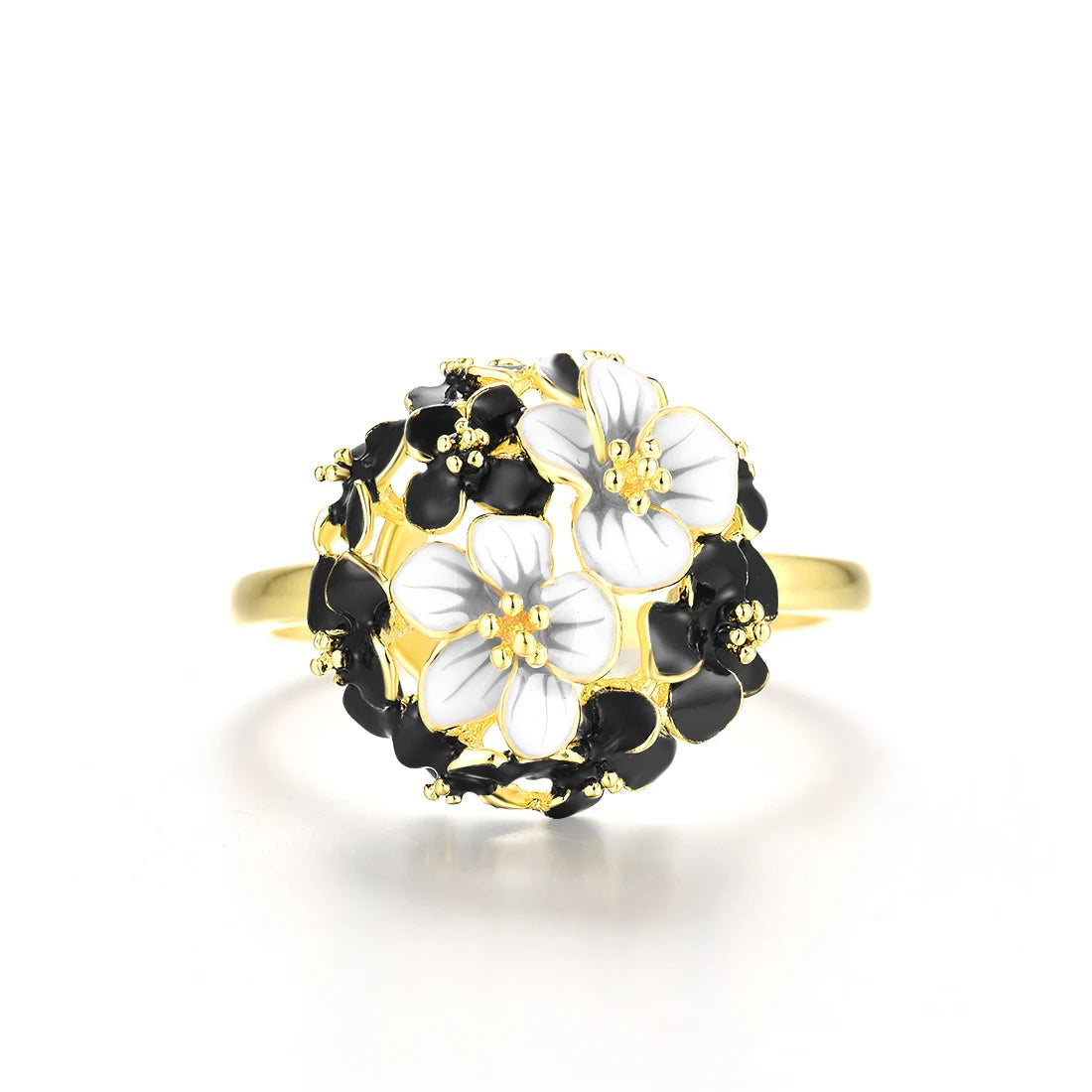 Gold ring featuring a dome of black enamel flowers with two white floral accents at the center, from the Jacobaeus line.