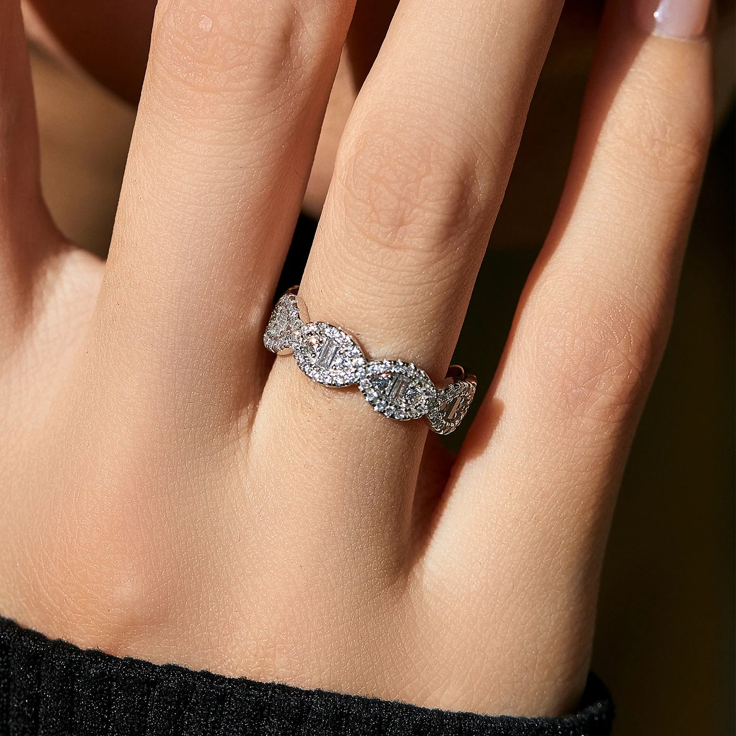 Silver eternity band with scalloped edges and baguette-cut cubic zirconia accents