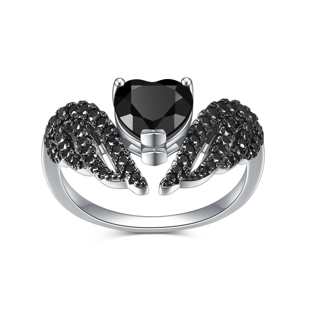 Sterling silver ring with a heart-shaped black gemstone flanked by pavé-set wing-like details, from the Ali Nere design.