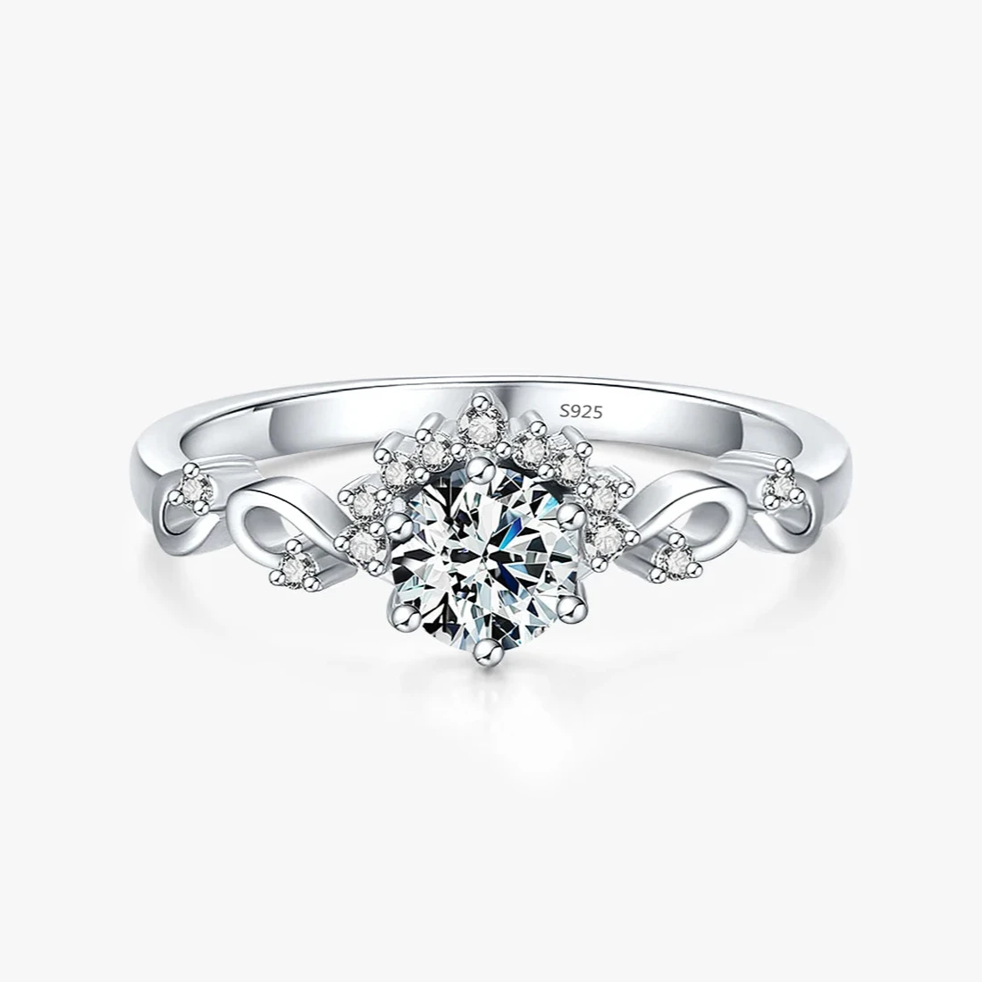 Silver ring with a central round-cut stone surrounded by delicate side diamonds and twisted vine-like detailing.