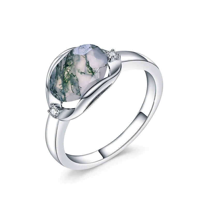Sterling silver ring featuring a translucent moss agate center stone with natural green inclusions, set in a sleek modern bezel.