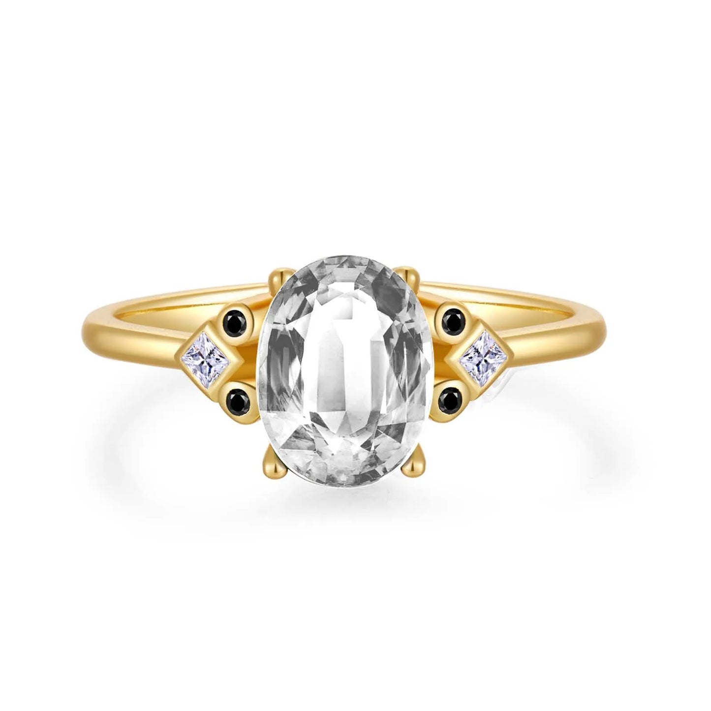 Gold ring with large oval brown gemstone and black and white accent stones