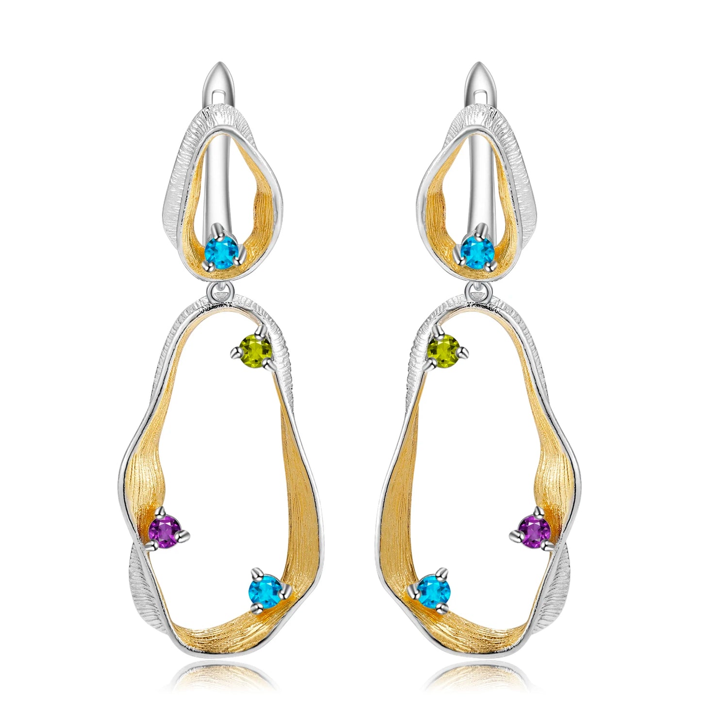 Dangling earrings with flowing gold and silver forms set with turquoise-colored stones