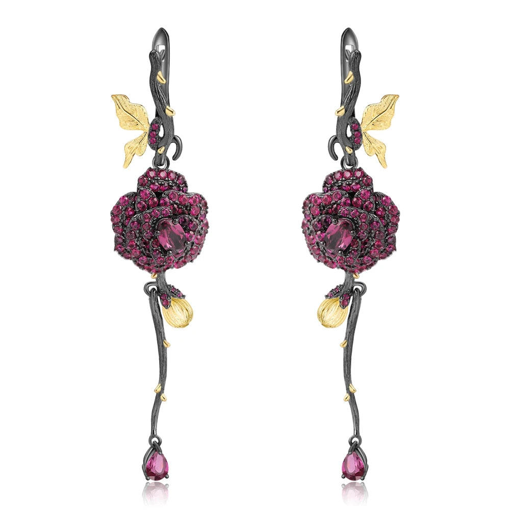 Long black rose earrings with red gemstones, gold leaves, and bud details from the Rossa Collection.