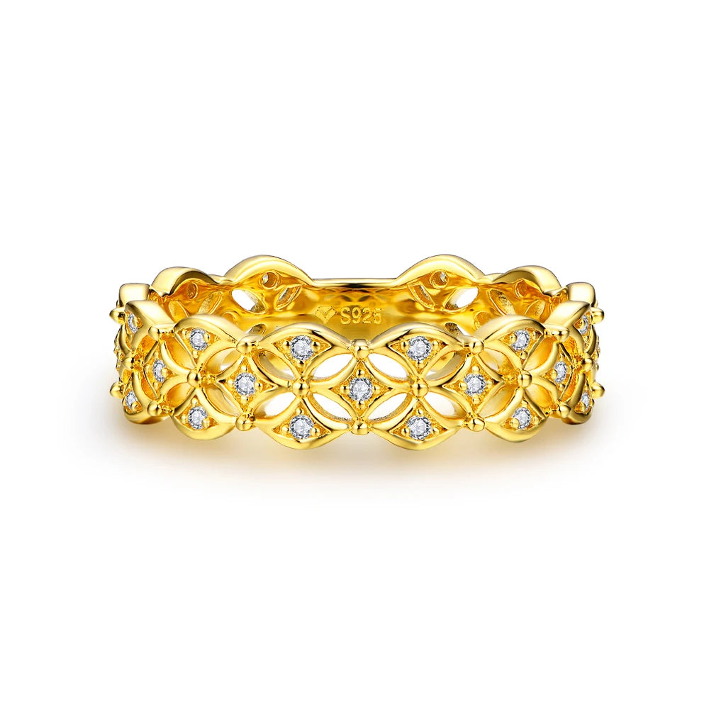 Gold-plated floral pattern ring featuring openwork petals set with small white stones throughout the band.